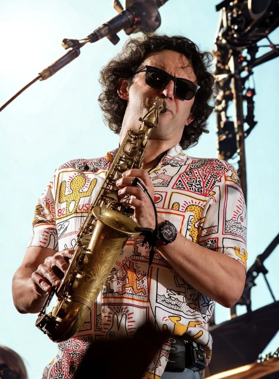 Tom playing saxophone at an eighties festival