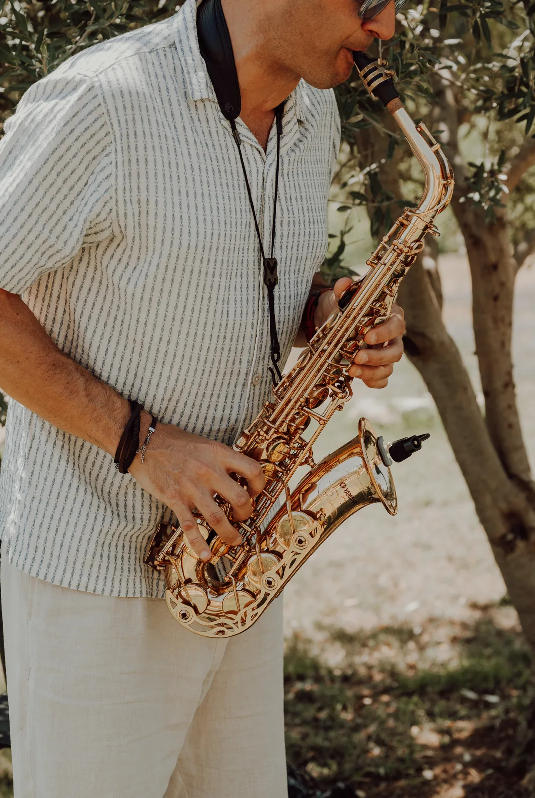 Tom playing solo saxophone at a ceremony in Nice