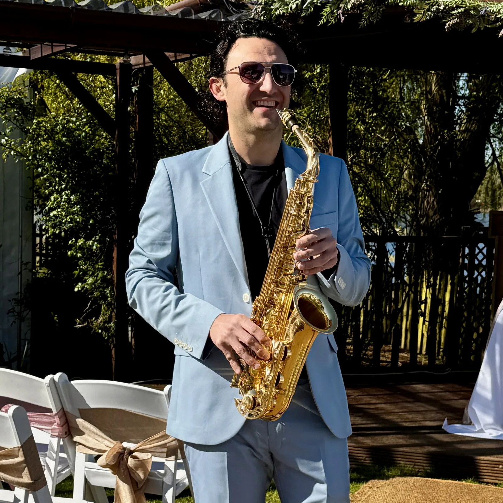 Tom playing at a drinks reception at Grendon Lakes
