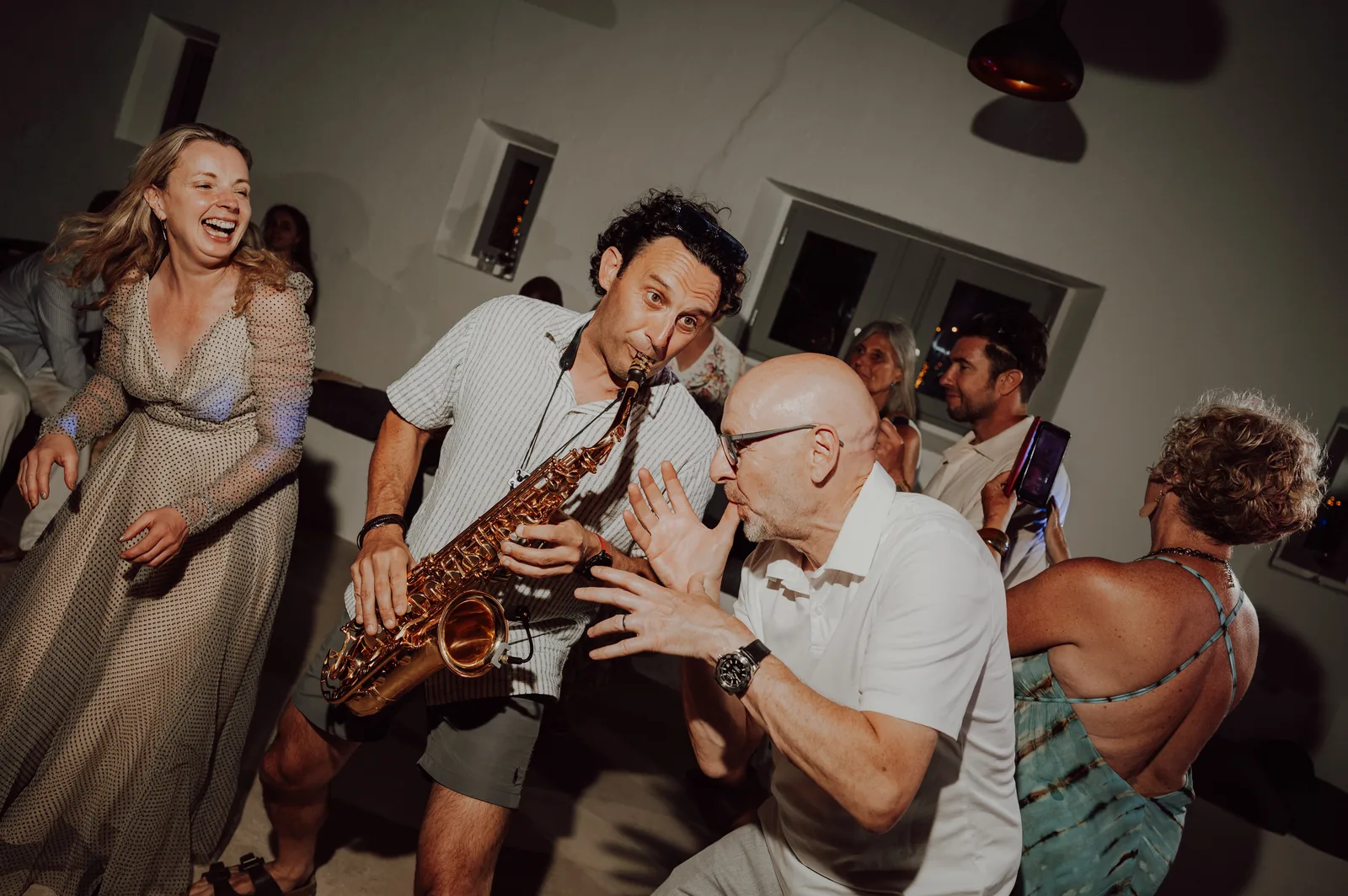 Tom playing saxophone to a full crowd in Ibiza